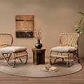 Rattan Lounge Chairs with Soft Cushions Round Rug Wooden Side Table Potted Plant and Wall Art