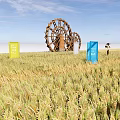 Rural Landscape With Golden Wheat Field Colorful Signs Wooden Waterwheels Blue Sky and White Clouds