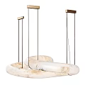 Ivory Marble Chandelier With Interlocking Ring Design Suspended By Black Cords And Golden Mounts