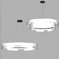 Two Contemporary White Chandeliers With Circular Layered Design And Warm Lighting