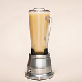 Modern Kitchen Blender Appliance With Silver Base And Yellow Liquid Inside