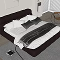 Modern Black Leather Tufted Double Bed With White Black Pillows Blanket Area Rug And Armchair
