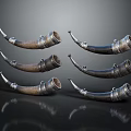 Vintage Decorative Horns With Silver Metal Accents Arranged On Black Reflective Background