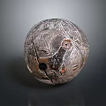 Antique Carved Spherical Sculpture Featuring Intricate Surface Patterns Holes and Cracks