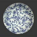 Blue and White Porcelain Plate With Floral Patterns and Leaf Designs