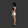 Woman In Blue Tank Top And Beige Skirt Standing With Black Sandals On Gray Background
