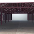 Industrial Style Spacious Open Space With Red Metal Frame Roof And Supporting Columns