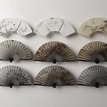 Traditional Chinese Fans Wall Decor with Various Patterns Arranged on White Wall