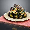 Sliced Zucchini Stacked With Savory Sauce And Sesame Seeds On Wooden Board