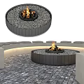 Outdoor Circular Fire Pit With Black Frame And Gray Pebbles For Garden Decor