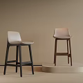 Modern Bar Stools With Light Seats And Black Brown Wooden Legs On Display Platform