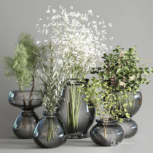 Decorative Glass Vases In Different Sizes Holding Various White Flowers And Fresh Greenery 3d model 