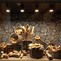 Bakery Window Display With Assorted Bread In Wicker Baskets And Hand Drawn Patterns 3d model