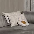 Cozy White Pillows And Flower Shaped Cushion With Yellow Center On Gray Sofa