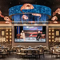 Huizhou Restaurant Interior With Large Screen Two People Talking Jellyfish Chandeliers Blue Decoration And Tables