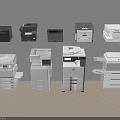 Various Black And White Office Appliances Including Multifunctional Printers And Different Models In Workspace 3d model