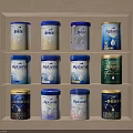Decorative Ornament Combination Featuring Aptamil Milk Powder Cans On Three Tiered Shelf