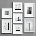 White Framed Black And White Architectural Photos On Gray Wall Gallery