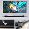 4K UHD Television Displaying Colorful Cave Landscape with Soundbar on White Shelf