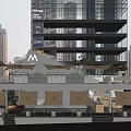 Modern Outdoor Café With Awnings Green Plants And Tall Buildings Backdrop