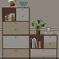Brown White Beige Storage Cabinet with Drawers Open Shelves Table Lamp Plant Books Photo Frame