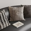 Various Textured Pillows On Black Sofa With Changing Your Mind Book 3d model