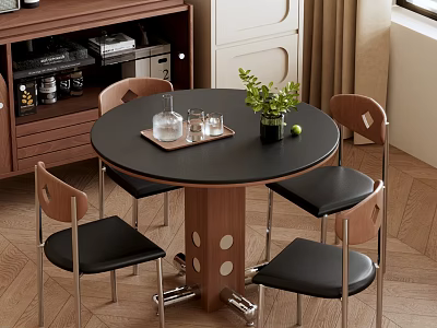 Round Black Tabletop Dining Table Set With Brown Legs Four Black Chairs And Small Plant 3d model