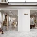 Elegant Bridal Shop with Grey Lace Wedding Dress on Display Platform and Hanging Bridal Gowns