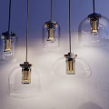 Modern Pendant Lights With Transparent Glass Shades And Metal Bases For Interior Decor