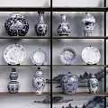 Traditional Blue and White Ceramic Wares on Wooden Display Shelf with Landscape Painting Background