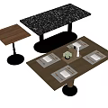 Wooden Dining Table With Place Settings Small Plant Black Countertop And Side Table