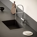 Modern Kitchen Faucet with Black Sink on Dark Countertop and Wooden Cutting Board