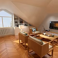 Cozy Attic Living Room With Herringbone Wood Floor Elegant Seats And Large Bright Window Design