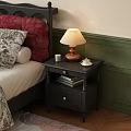 Dark Wooden Bedside Table With Table Lamp Teacup And Books Near Green Wall
