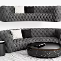 Irregular Shaped Quilted Sofa With White Black Pillows And Round Marble Coffee Table 3d model