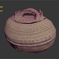Carved Sculptural Pottery Jar With Lid Handles And Intricate Circular Patterns