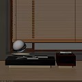 Stylish Coffee Table Set With Wooden Blinds Round Decorative Ball And Books In Living Room