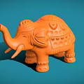 Orange Elephant Sculpture With Intricate Carved Patterns On Blue Background