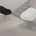 Modern Black and White Leisure Chairs with Metal Wire Legs in Staircase Background