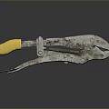 Rusty Pliers With Yellow Handle And Rusty Metal Parts On Black Reflective Surface