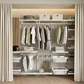 Organized Wardrobe Interior With Hanging Clothes Folded Items Storage Boxes And Drawers