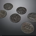 Ancient Metal Coins Featuring Sculpted Portraits And Detailed Historical Engravings