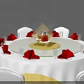Round Dining Table Set With White Tablecloth Gold Rotating Centerpiece White Chairs Red Napkins Glassware