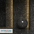 Black Spherical Component on Black Marble Textured Walls and Floor with Golden Lighting