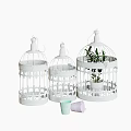 Three White Decorative Pet Cages With Carved Patterns And Potted Plants 3d model