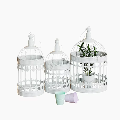 Three White Decorative Pet Cages With Carved Patterns And Potted Plants 3d model