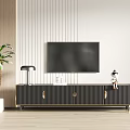Modern Black TV Stand with Vertical Stripes Gold Handles TV Table Lamp and Potted Plant
