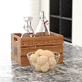 Decorative Ornament Set With Wooden Crate Glass Bottles Metal Wire Basket And Potatoes On Countertop