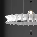 Modern White Chandelier with Wave Design Hanging from Metallic Cables on Dark Wall