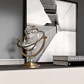 Elegant Gold Armillary Sphere Decor With Books And Black White Architectural Painting On White Shelf